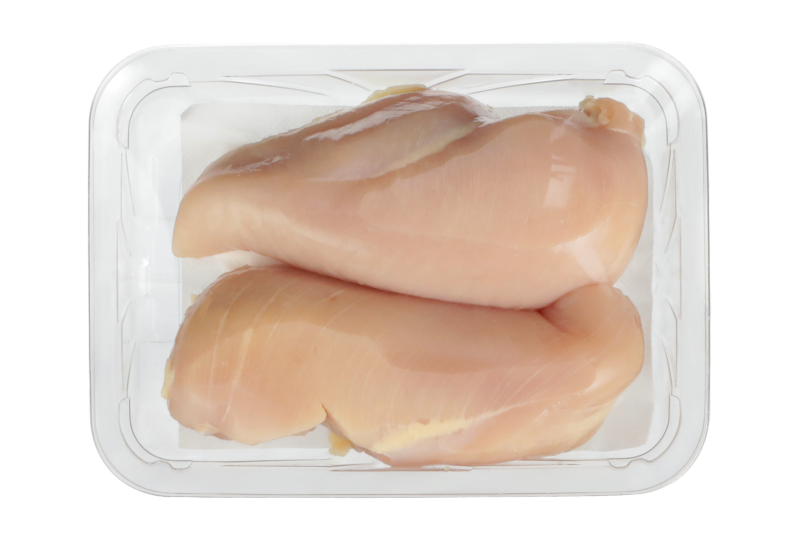 CRYOVAC brand SES overwrap film over chicken thighs in clear tray